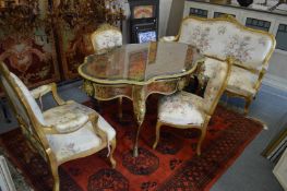A French style gilt framed and floral upholstered four piece salon suite comprising settee, armchair