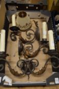 A decorative wrought iron twin branch wall light and a pair of matching single branch wall lights
