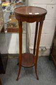 A mahogany two tier jardiniere stand.