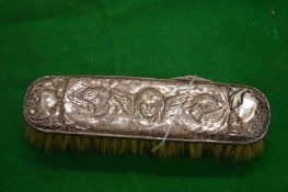 Silver backed dressing table brush.