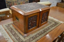 A very good Victorian carved walnut table top canteen fitted with four graduated drawers.