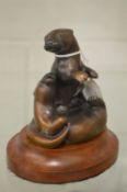 A small bronze group of an otter and young.