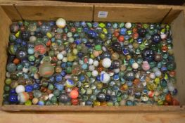 A wooden box of marbles.