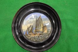 A porcelain pot lid, Hauling the Trawl, framed.