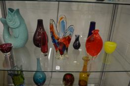 Colourful art glass vases and bowls.