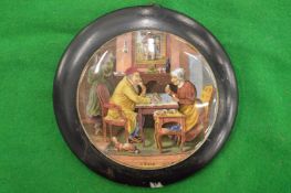 A pair of porcelain pot lids, framed (chips to base).