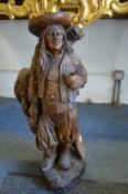A good large Continental carved wood figure of a gardener.