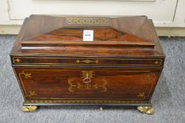 A very good Regency brass inlaid rosewood sarcophagus form tea caddy with fitted interior.