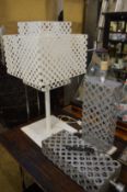 An unusual large white painted table lamp with pierced metal shade and two other lamps.