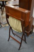 An Edwardian mahogany folding work table.
