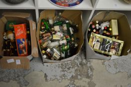 Three boxes of liqueur miniatures, some empty.