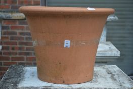 A large terracotta plant pot.