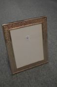 A large silver plated photograph frame.