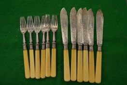 A set of six bone handled silver fish knives and forks.