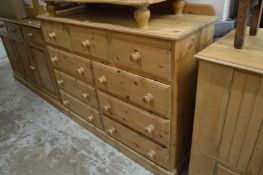 A large pine chest of drawers.