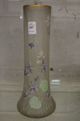 A floral enamel decorated opaque glass vase.