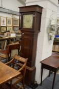 A 19th century oak and mahogany longcase clock with eight day movement and painted square dial.