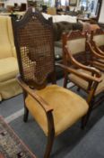 A high back beech framed armchair.