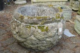 A large composite garden planter.