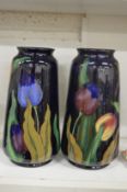 A pair of tulip decorated vases.