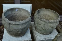A pair of composite garden planters.