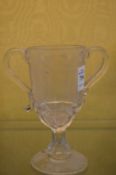 An etched glass twin handled pedestal cup 'A present from Hebden Bridge'.