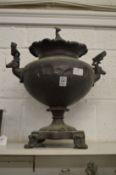 A copper samovar, the lid with greyhound finial, the handles modelled as stags heads.