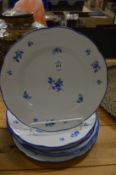 A set of six Meissen plates, blue painted with floral detail.