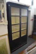 A large Continental ebonised four door display cabinet.