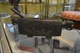 A New Guinea carved wood slit drum.