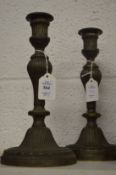 A pair of brass candlesticks.