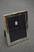 A large silver plated photograph frame.