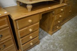 A pine pedestal dressing table.