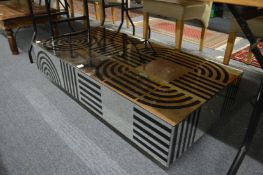 A stylish mirrored low coffee table.