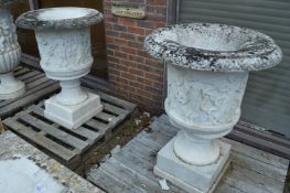 A good pair of carved Italian white marble Campagna urns on stands, the urns 92cm high, the pedestal