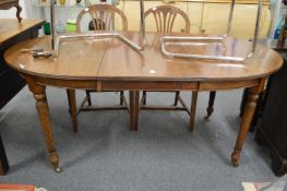 A mahogany extending dining table.