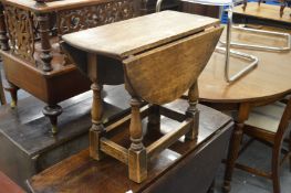 An oak drop flap occasional table.