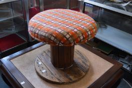 An unusual large circular foot stool made from a cable drum.