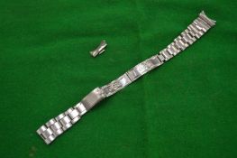 A Rolex stainless steel ladies watch strap.