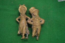 Two cast bronze figures.