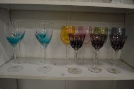 Quantity of colourful wine glasses.