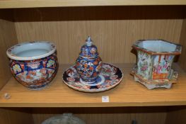 A Chinese famille rose hexagonal shaped jardiniere stand and three pieces of Imari porcelain.