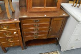 An Edwardian mahogany music cabinet.