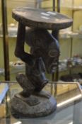 A good tribal carved wood figural stool, Congo region.