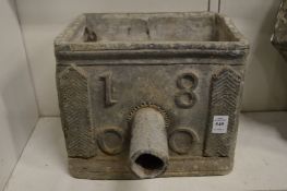 A lead rainwater hopper dated 1800.