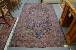 A Persian carpet, blue ground with floral decoration 270cm x 150cm.