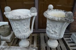 A large impressive pair of Italian carved white marble twin handled urns, one repaired 110m high.