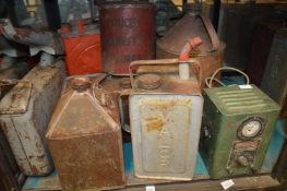 An old battery charger, petrol cans etc.