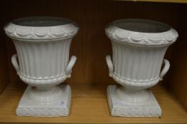 A pair of Casa Pupa urn shaped jardinieres or vases.