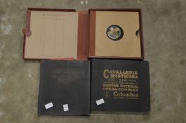 Three cased sets of gramophone records.